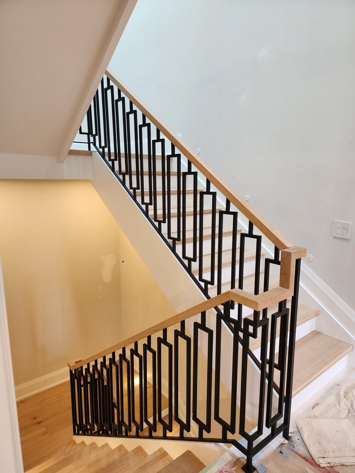 Custom iron railing installation in Toronto home