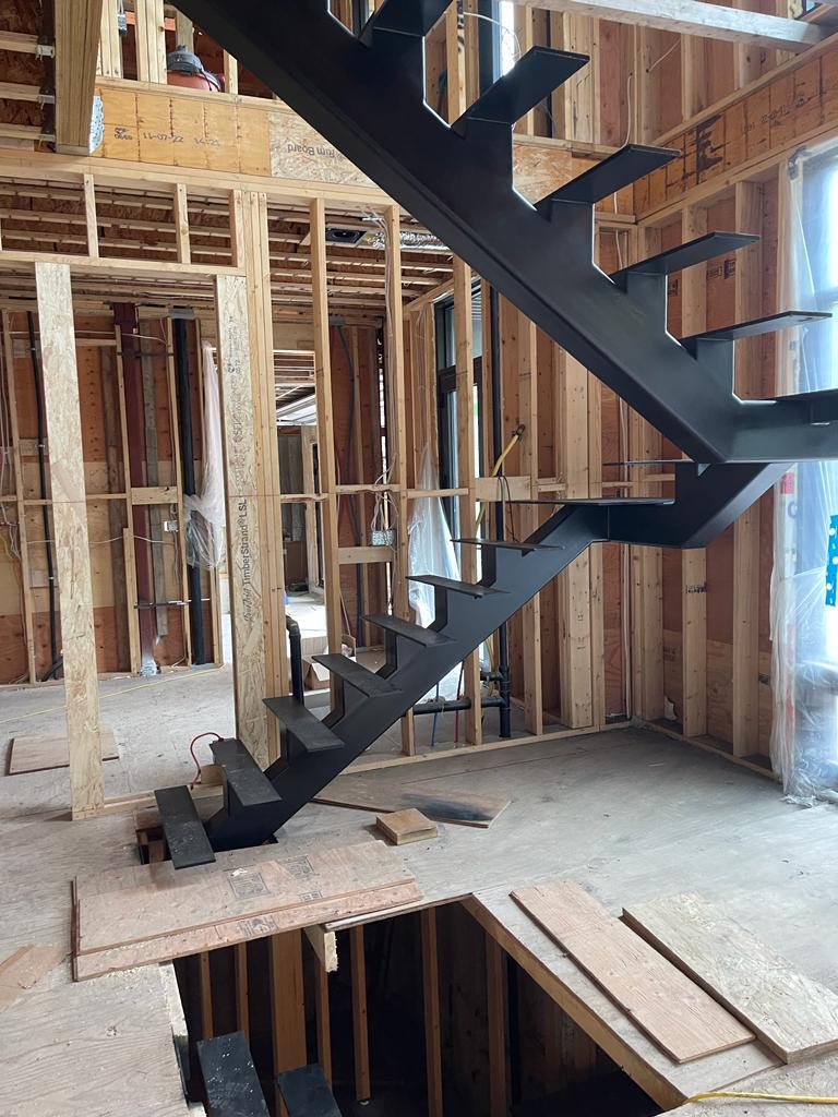 Custom iron railings and stairs installed in Toronto home